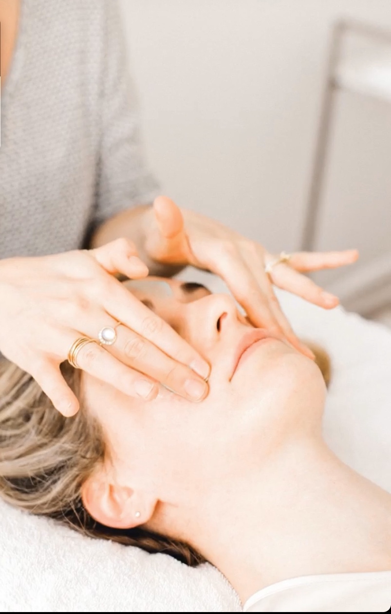 hands touching face during skin resurfacing service