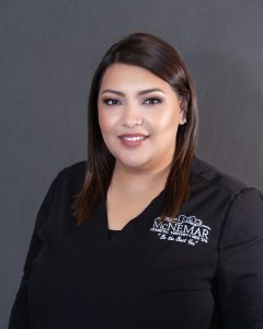 Daenne Montoya in black scrubs at McNemar Cosmetic Surgery