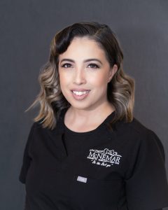 Nashielly Rojas in black scrubs at McNemar Cosmetic Surgery