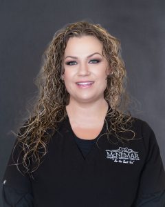 Tiffany Herr in black scrubs at McNemar Cosmetic Surgery