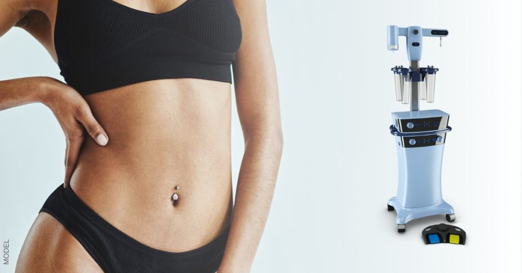 Woman with flat stomach (model) next to VaserLipo machine.